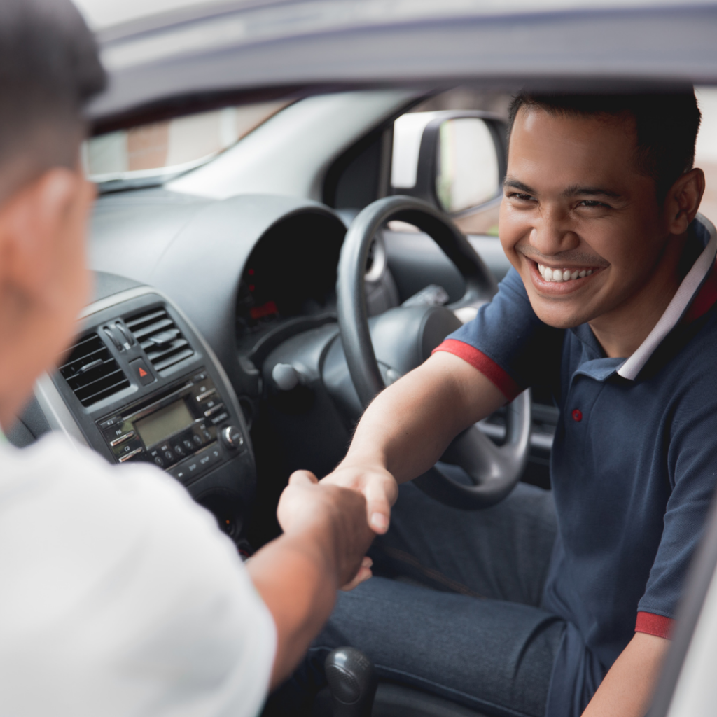 An image of a "Private Hire Taxi Driver" collecting there new vehicle.